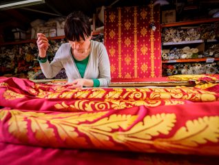 Silk drapes being finished by hand | Royal Pavilion and Museums Brighton & Hove