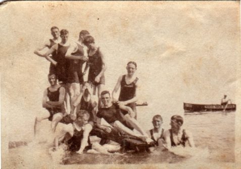 Photograph of men [possibly off-duty servicemen] in bathing suits in the sea