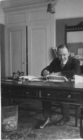 Photograph of Arthur Jolly in his office