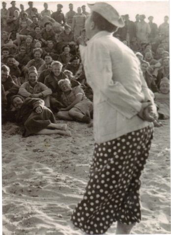Photograph showing Ray Harris performing with the Jerboa Strollers concert party at Jerboa Bay, near Tobruk, Libya