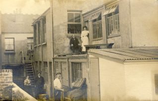 Rear of 22 Crescent Road, early 1900s.  L-R Sarah Tidey, William Tidey, William Tidey junior. Maud Tidey standing in the upper storey doorway, next to her grandfather, Robert Cramp, seated