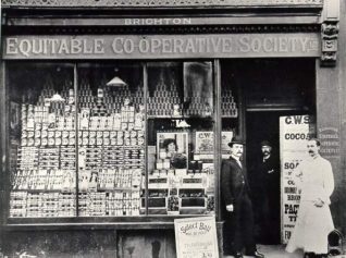 North Road Co-op with staff posing in the doorway. The store at 32 North Road opened in May 1888 | Image reproduced with kind permission from Brighton and Hove in Pictures by Brighton and Hove City Council