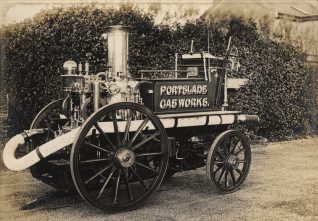 Photograph from the Local History Collection. Monochrome photographic print showing an early steam fire engine with sign bearing 'Portslade Gasworks'. c.1900-1911. | Royal Pavilion and Museums' Image Store