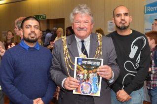 The Mayor with an edition of Signs and Voices - deaf super hero comic | Photo by Tony Mould