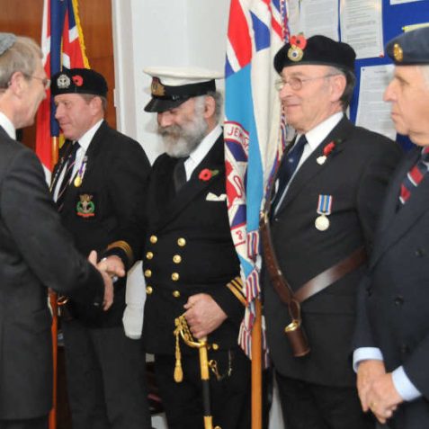 The standard bearers are welcomed by the Lord Lieutenant of East Sussex, Peter Field | Photo by Tony Mould