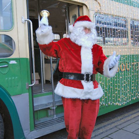 Santa arrives by bus to collect for the Argus Christmas Appeal | Photo by Tony Mould