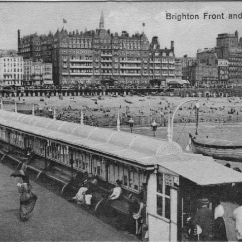 West Pier in 1913 showing the sheltered seating that ran the length of the promenade deck. | From the private collection of Tony Drury