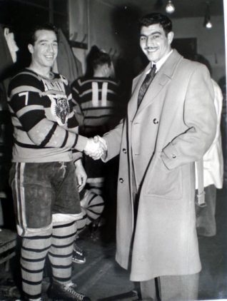 This photo was taken on the 15th March 1951 and shows Bobby Lee (Captain and Coach) of the famous Brighton Tigers greeting the Heavyweight Boxing Champion, Jack Gardner in the Tigers changing rooms | From the private collection of Trevor Chepstow