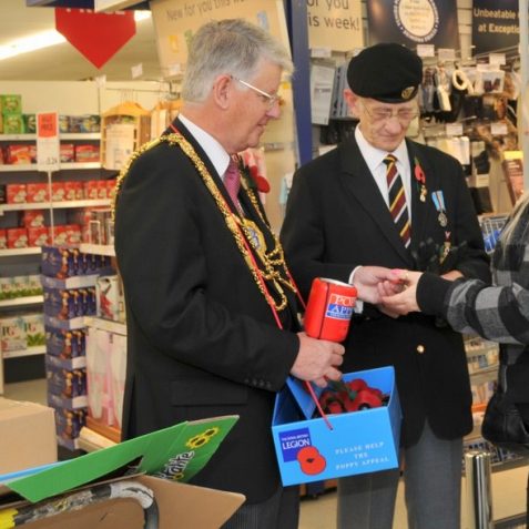 The Mayor, Councillor Garry Peltzer Dunn selling poppies in a Brighton supermarket | Photo by Tony Mould