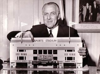Benny Lee holding model of the S.S. Brighton, 1959 | Image scanned from the collection of Trevor Chepstow, Sports Stadium Brighton Archive