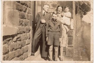 Photo of Bobby Gunn with his foster family, the Downs, in 1941 | From a private collection