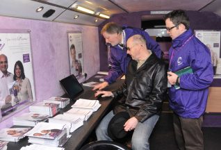 Brian and Dave from the census bus team show Spooks the Census website | Photo by Tony Mould