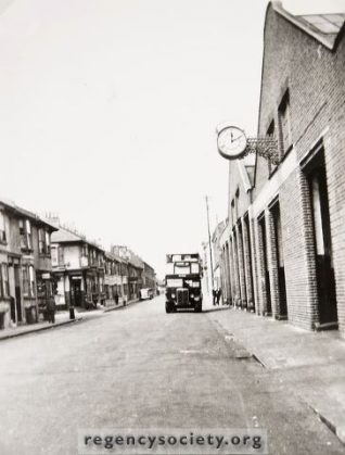 The view westwards along Conway Street, from opposite Ellen Place, in 1938, and before the garage was extended east to the corner of Goldstone Street. Many years ago the stables of the old horse Bus Company were here, and the premises were gradually converted to a garage as Motor buses replaced the horses. | Image reproduced with kind permission of The Regency Society and The James Gray Collection