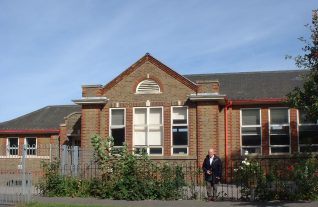 Dad outside his old school | From the private collection of Pat Mathewson