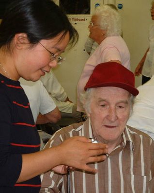 Sandra shows Eddie how the mini-disc recorder works | Photographs taken by Zoë Woods and Sandra Koa Wing