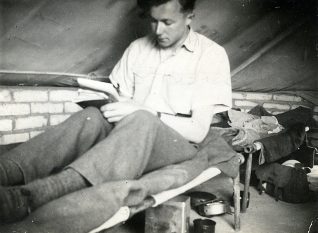 George Horrobin writing a letter in his camp in Iraq | Reproduced by kind permission of Tricia Leonard