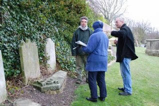 Co-ordinator Simon Bannister (1st right) in discussion with two volunteers | Photo by Tony Mould