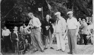 The schoolboy caddying for Bill Spence is John Stenning a long time member of the golf club. | Courtesy of John Stenning