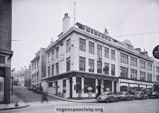 The north side of Western Road, at the corner of Marlborough Street - 29 January 1955. During this year the Golden Cross Inn, which like Johnson's had been completely rebuilt in 1928/30, was sold to Johnson Bros. who reconstructed the premises as an extension of their shop. Click on the photo to open a large version in a new window. | Image reproduced with kind permission of The Regency Society and The James Gray Collection