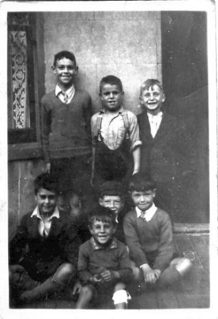 Me, standing 1st right, and a group of pals outside our house | From the private collection of Ken Burt