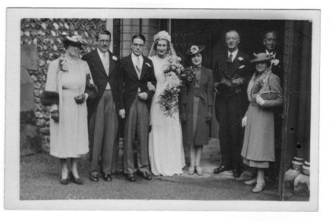 Photograph of the wedding party of Francis and Cynthia Price (nee Chase) outside the Old Church [St Andrew's], Hove
