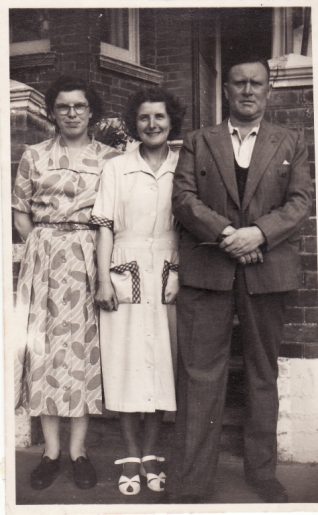 Photo of Margaret Rich aged 15 with Win and Ted in front of house in Balfour Road