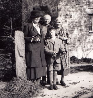 Muriel is on the right. A caption on the back of the photo names the people as (from left to right): Aline, John, Mike (the boy), Muriel. It also reads: Clos ?Slus Cottage, 1951. | Photo contributed to Letter in the Attic collection by Francis Clark-Lowes