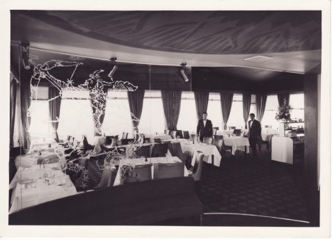 Photograph of the Starlit Room, Hotel Metropole with two waitors