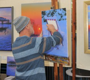 Local artist Philip Dunn demonstrates his work | Photo by Tony Mould