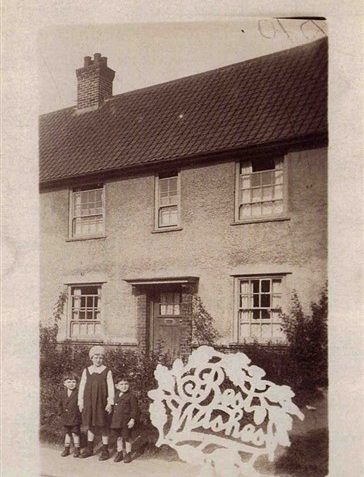 Johnny -Bet-and me, Ron taken by a neighbour and given as a Christmas card. About 1932. Outside 34 Newick Road. | From the private collection of Ron Spicer