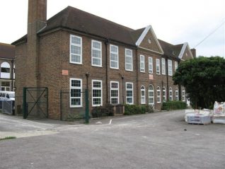 Moulsecoomb Senior Boys' School this end, girls' the other.  The allotments were across the lane at this end of the school.   Also at the foot of that lane was a temporary mortuary, situated up the lane above the allotments. | Photo by Ron Spicer.