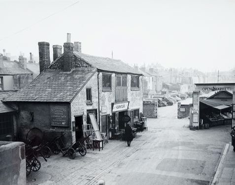 Entrance to Marshall's Row, showing the premises of W. Dawkins, the blacksmith on the left of the photograph | Image reproduced with kind permission of The Regency Society and The James Gray Collection