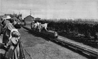 Passengers riding on the small train, the Coastguard  signal tower can be seen in the background.. Click on photo to open large image in new window. | From the private collection of Tony Drury