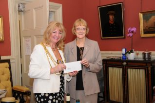 Jennifer receives our donation from The Mayor | Photo by Tony Mould