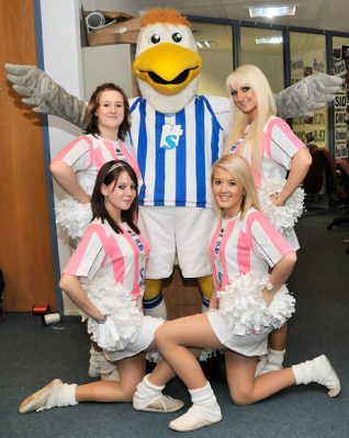 'Gully' the Brighton and Hove Albion mascot, with four of his gorgeous 'Gully's Girls' | Photo by Tony Mould