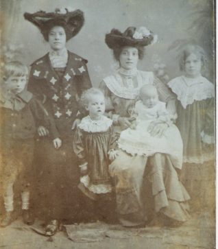 Photo shows Annie(seated with baby)and four of her eight children. Also, standing, her younger sister Kate Louise, who died shortly after this photo was taken. | From the private collection of Jane Hanick