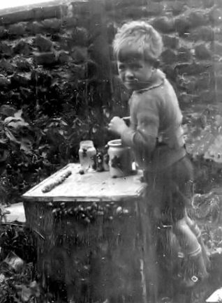 Me racing snails in the back garden at Tivoli Crescent | From the private collection of Sid Griffiths