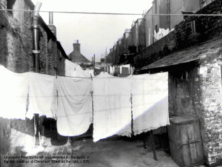 Claremont Row on the left was dwarfed by the high buildings of Claremont Road on the right. c.1935