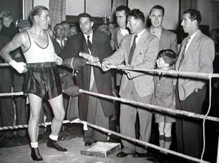 A regular visitor to the Sports Stadium this photograph shows Tommy training for his come back fight and is seen chatting to visiting members of the famous 