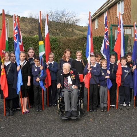 Standard bearers with Henry Allingham, 112 year old WWI veteran | Photo by Tony Mould
