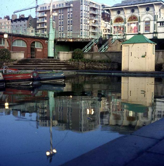 West Pier steps and boating lake, 1967. Note the crane building Sussex Heights in the background. The Punch and Judy Man would perform on the right at the foot of these steps at weekends. | Photo by Peter Allison