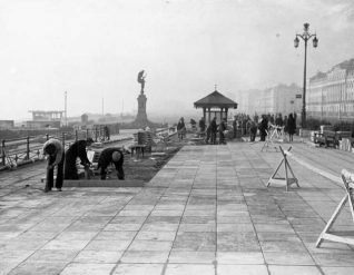 Laying Paving, c. 1940: The twin-pendant strett lamps on the King's Road can be seen in this picture. | Image reproduced with kind permission from Brighton and Hove in Pictures by Brighton and Hove City Council