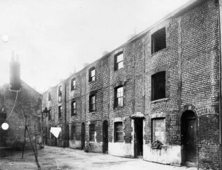 Flint and Cobble Buildings , c. 1910; A row of houses in the Carlton Hill area, built in c.1790 of flint and cobble-stones. These were probably demolished in the 1930s as part of Brighton Borough Council's ambitious slum-clearance programme. | Image reproduced with kind permission from Brighton and Hove in Pictures by Brighton and Hove City Council