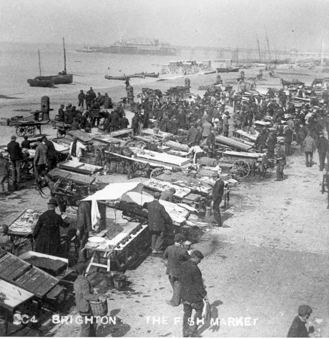 Brighton Fish Market, 1899: For many centuries, Brighton's fish market was situated on the beach below the low cliffs at the end of East Street, now built over by Grand Junction Road. From the 1880s the fish market at Brighton beach was at 216-224 King's Road Arches, with a hard area provided in front for stalls. Although fishing decreased during the 20th century, the market still sold 