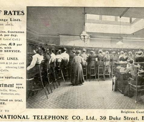 National Telephone Company Switchboard, c. 1907: A postcard advertising the National Telephone Company Ltd of 39 Duke Street, Brighton. In the centre is a view of Brighton Central Exchange, staffed almost entirely by women | Image reproduced with kind permission from Brighton and Hove in Pictures by Brighton and Hove City Council