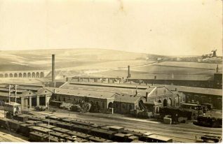 Engine Sheds at Brighton Station., 1868: Aerial view of trains and engine sheds at Brighton Station. The New England Hill viaduct can be seen on the left, a windmill to the right. Little development of Brighton has yet taken place in this photograph. | Image reproduced with kind permission from Brighton and Hove in Pictures by Brighton and Hove City Council