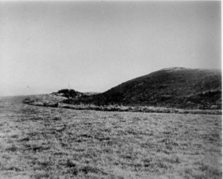 Hollingbury Camp, Date not known: North-east corner of Hollingbury Camp. This is an Iron Age hill fort dating from the sixth century to about the middle of the second century BCE. It is a scheduled ancient monument, covering about 9 acres in a rough square about 600 feet across, with gateways to east and west through ramparts that can still be seen. The camp was excavated in 1908 by Herbert S. Toms, a Curator at Brighton Museum, by Cecil Curwen and Brighton and Hove Archaeological Society in 1931, and by John Holmes in 1967. The sites of wooden huts have been discovered. | Image reproduced with kind permission from Brighton and Hove in Pictures by Brighton and Hove City Council
