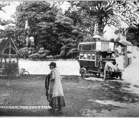 Patcham Village Centre, 1905: Patcham Village centre in 1905. This was then the main road from Brighton to London, before the Patcham by-pass opened in 1926. On the left is a public drinking fountain. The open-top omnibus is on the No. 5 route from Brighton to Patcham. | Image reproduced with kind permission from Brighton and Hove in Pictures by Brighton and Hove City Council